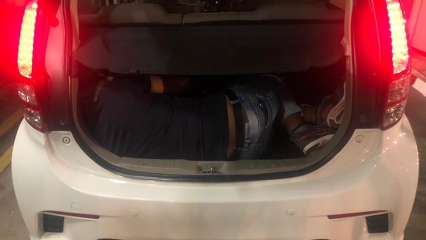 Two Malaysians arrested for attempting to smuggle man out of Singapore in car boot Two Malaysians arrested for attempting to smuggle man out of Singapore in car boot