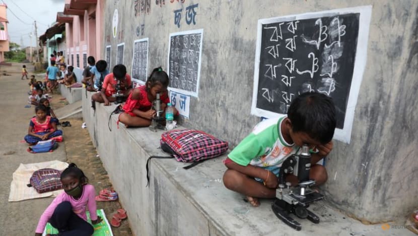 In remote Indian village, teacher turns walls into blackboards to close learning gap