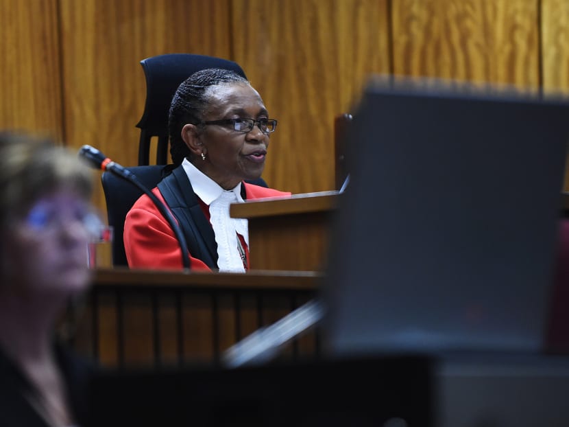 Judge Thokozile Masipa reads notes as she delivers her verdict in the Oscar Pistorius murder trial in Pretoria, South Africa, Sept 11 2014. Photo: AP