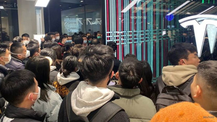 Tesla owners in China protest against surprise price cuts they missed Tesla owners in China protest against surprise price cuts they missed