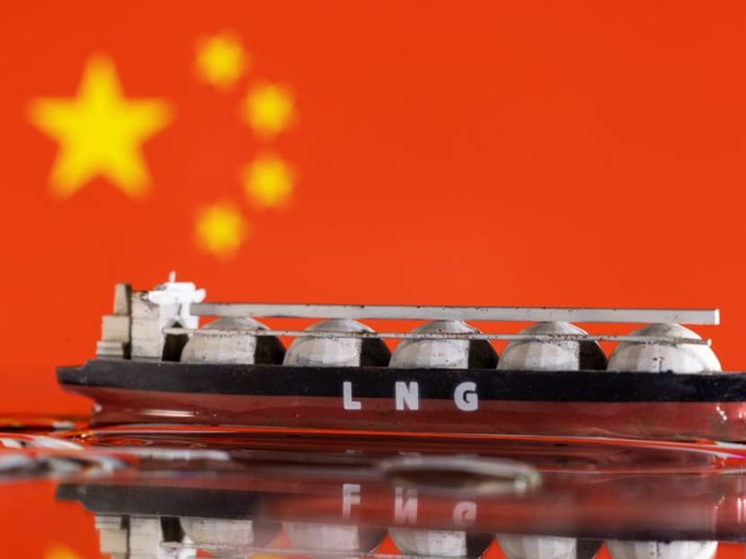 FILE PHOTO: Model of LNG tanker is seen in front of China's flag in this illustration taken May 19, 2022. REUTERS/Dado Ruvic/Illustration