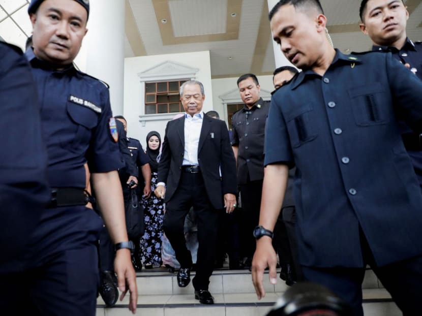 Former Malaysian Prime Minister Muhyiddin Yassin (centre) walking outside Kuala Lumpur Court Complex in Kuala Lumpur, Malaysia on March 10, 2023. 