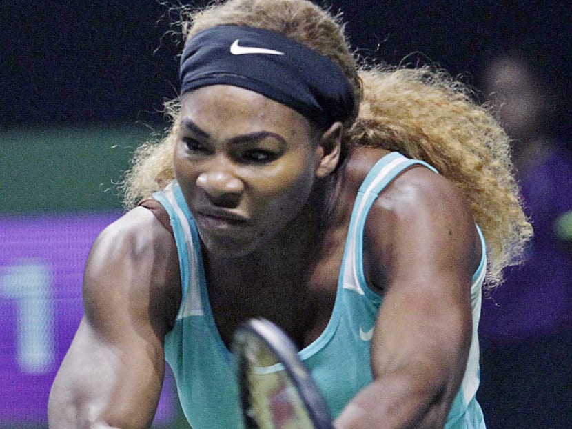 Williams amazed fans with her flexibility en route to her 16th consecutive win at the WTA Finals. WEE TECK HIAN
