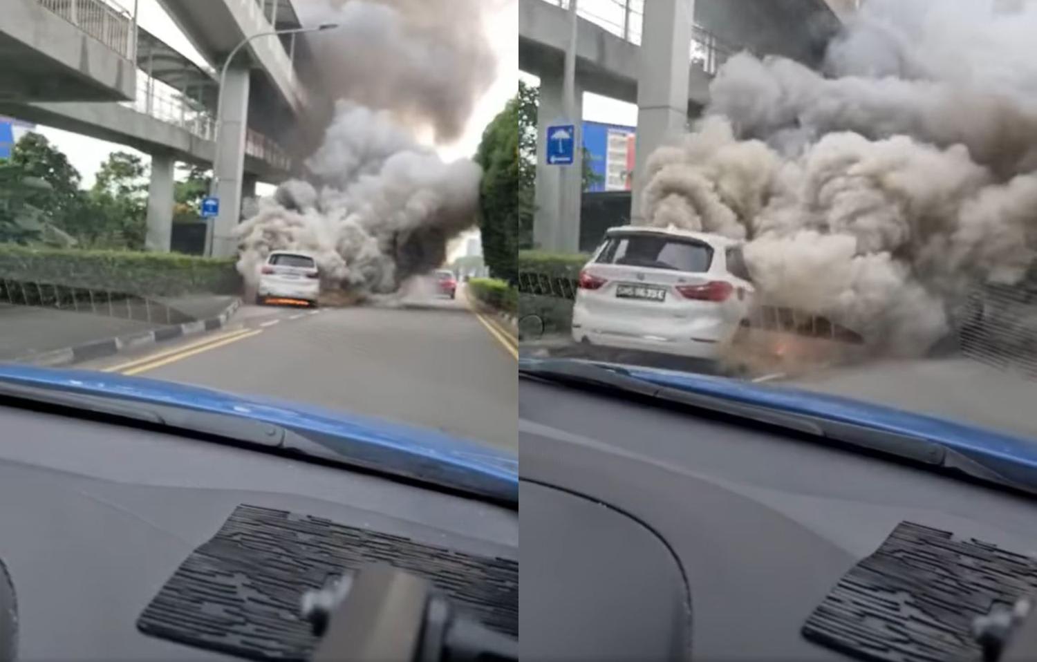 In a video posted on the Singapore Taxi Driver Facebook group, a car on fire can be seen along a slip road, with smoke billowing from its engine. In a video posted on the Singapore Taxi Driver Facebook group, a car on fire can be seen along a slip road, with smoke billowing from its engine.