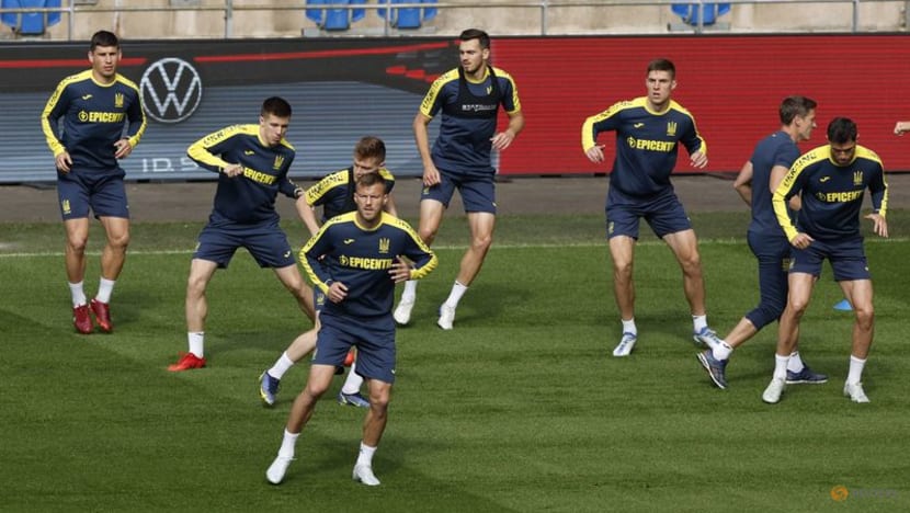Ukraine players gifted flag by soldiers ahead of Wales showdown Ukraine players gifted flag by soldiers ahead of Wales showdown