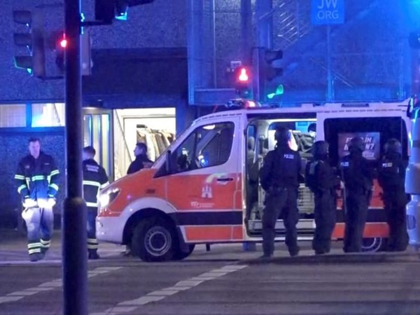 Emergency workers and police are seen gathering at the scene following a deadly shooting in Hamburg, Germany, March 9, 2023 in this still image taken from video. Emergency workers and police are seen gathering at the scene following a deadly shooting in Hamburg, Germany, March 9, 2023 in this still image taken from video.