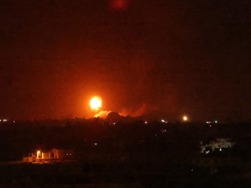 A fireball rises following an air strike in Khan Yunis in the southern Gaza Strip, late on August 23, 2021. A fireball rises following an air strike in Khan Yunis in the southern Gaza Strip, late on August 23, 2021.