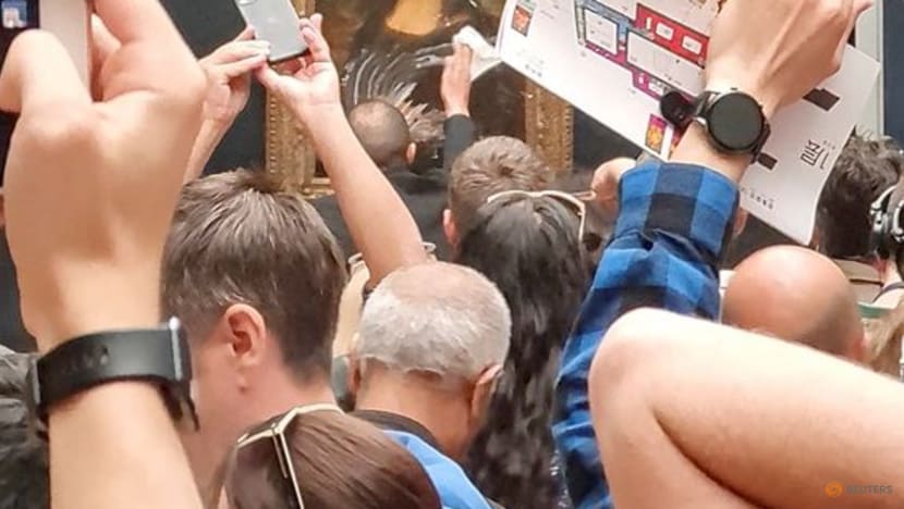 Mona Lisa left unharmed but smeared in cream in climate protest stunt Mona Lisa left unharmed but smeared in cream in climate protest stunt