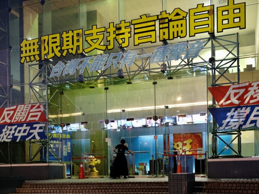 Media freedom slogans are displayed at the front entrance to Taiwan's CTi television building in Taipei on Nov 18, 2020, after regulators declined to renew their licence, saying interference by its staunchly pro-China owner had violated press freedom.