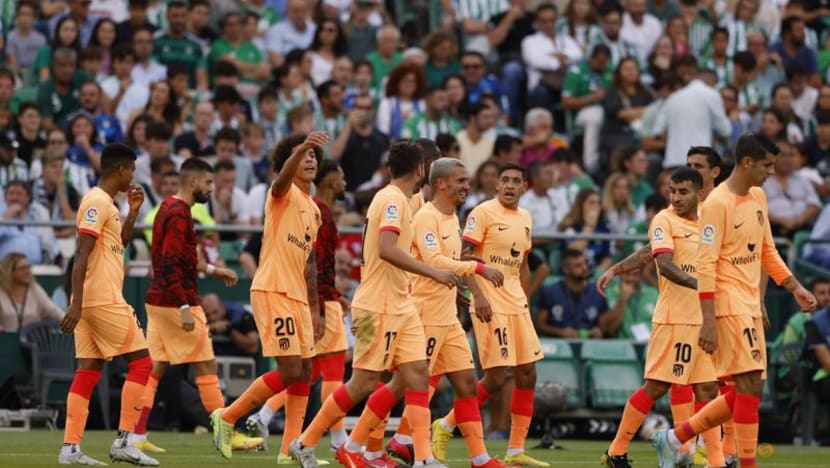 Griezmann scores twice as Atletico Madrid win at Real Betis Griezmann scores twice as Atletico Madrid win at Real Betis