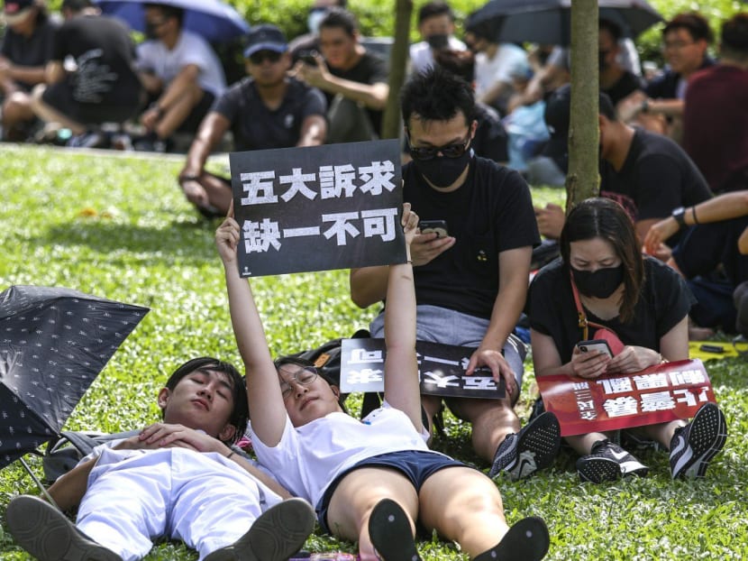 Protesters sneak a nap during a rally to support striking students at Tamar Park on Tuesday (Sept 2).