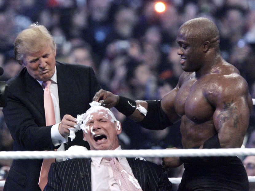 In this April 1, 2007, file photo, Donald Trump and Bobby Lashley (R) shave the head of Vince McMahon at Wrestlemania 23 at Ford Field in Detroit. Photo: AP