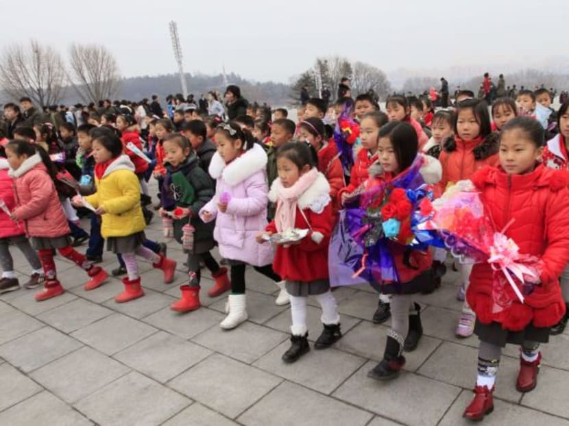 Service personnel, working people of various circles, school youth and children visiting the statues of President Kim Il Sung and leader Kim Jong Il across the country to pay tribute on the occasion of the Day of the Shining Star, Kim Jong Il's birth anniversary on Feb 16, 2017. Photo: AP