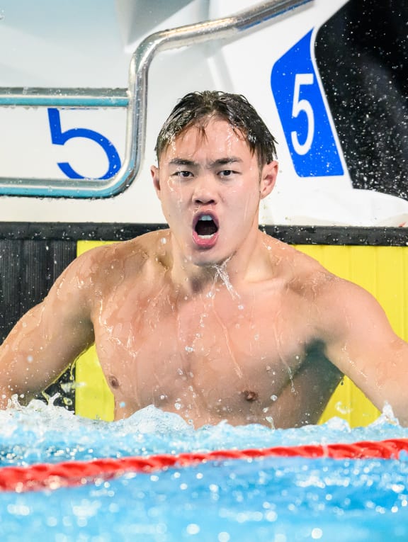 Teong Tze Wei celebrates his new SEA Games record in the 50m freestyle. 