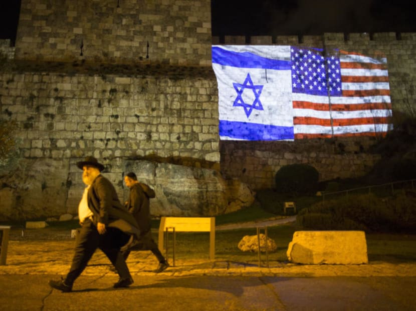 The Israeli and American flags are projected on the wall of the Old City of Jerusalem. US President Donald Trump's decision to move the US embassy to Jerusalem followed intense lobbying by conservative Christians. Photo: The New York Times