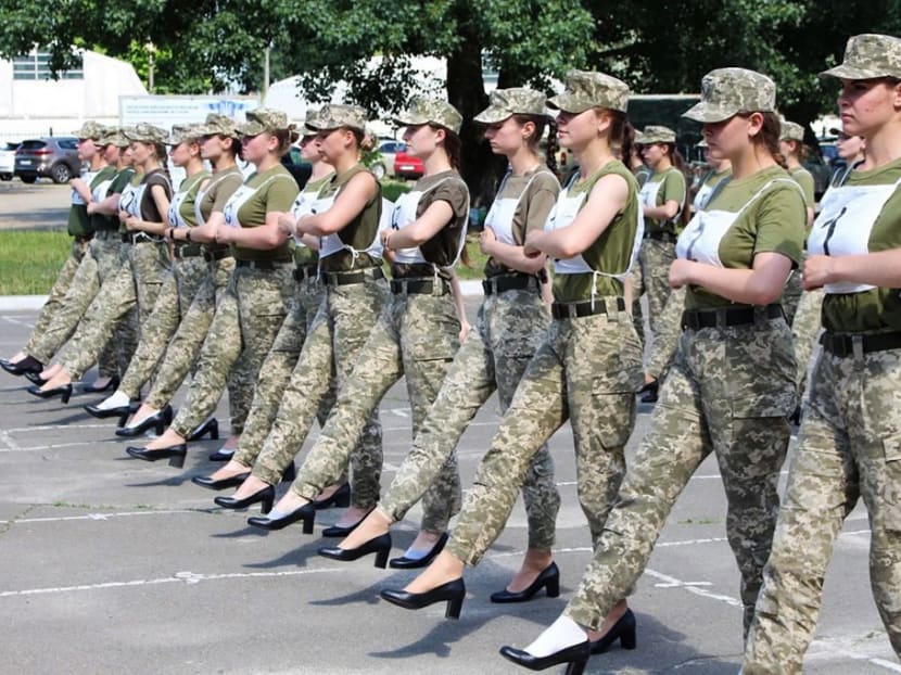 A handout photograph taken and released by the Ukrainian Defence ministry press-service on July 2, 2021 shows the Ukrainian female soldiers wearing heels while taking part in the the military parade rehearsal in Kiev.