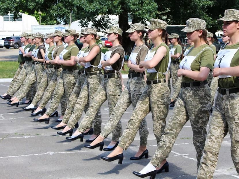 A handout photograph taken and released by the Ukrainian Defence ministry press-service on July 2, 2021 shows the Ukrainian female soldiers wearing heels while taking part in the the military parade rehearsal in Kiev. A handout photograph taken and released by the Ukrainian Defence ministry press-service on July 2, 2021 shows the Ukrainian female soldiers wearing heels while taking part in the the military parade rehearsal in Kiev.
