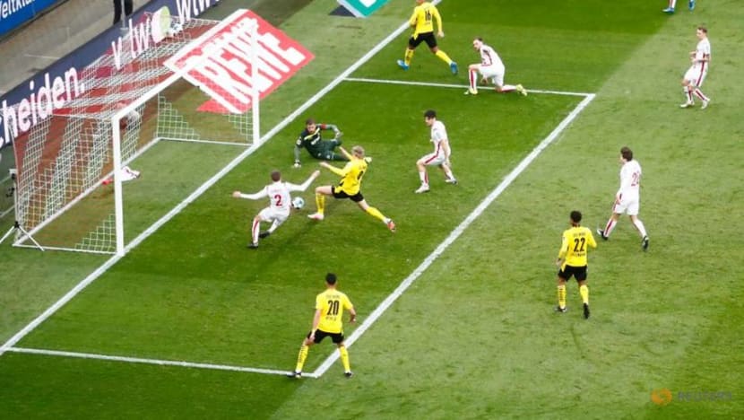 Soccer-Last-gasp Haaland gives Dortmund 2-2 draw at Cologne Soccer-Last-gasp Haaland gives Dortmund 2-2 draw at Cologne