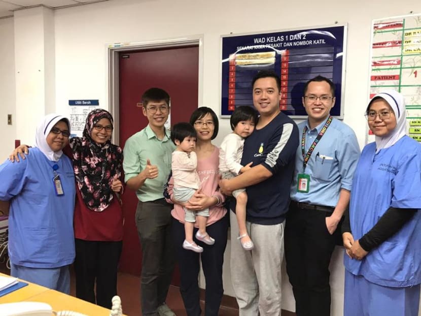 The unnamed four-year-old Chinese girl (in her father’s arms) who was infected with the novel coronavirus had undergone treatment and has been given the all-clear to return home to China.