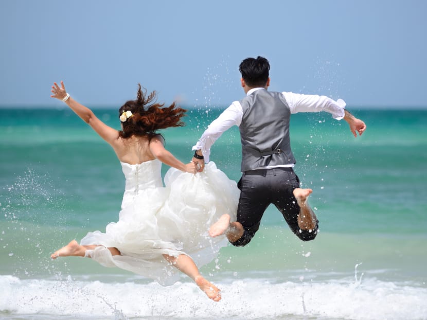 Commentary: Why are people spending more on travel and weddings even as prices go up?