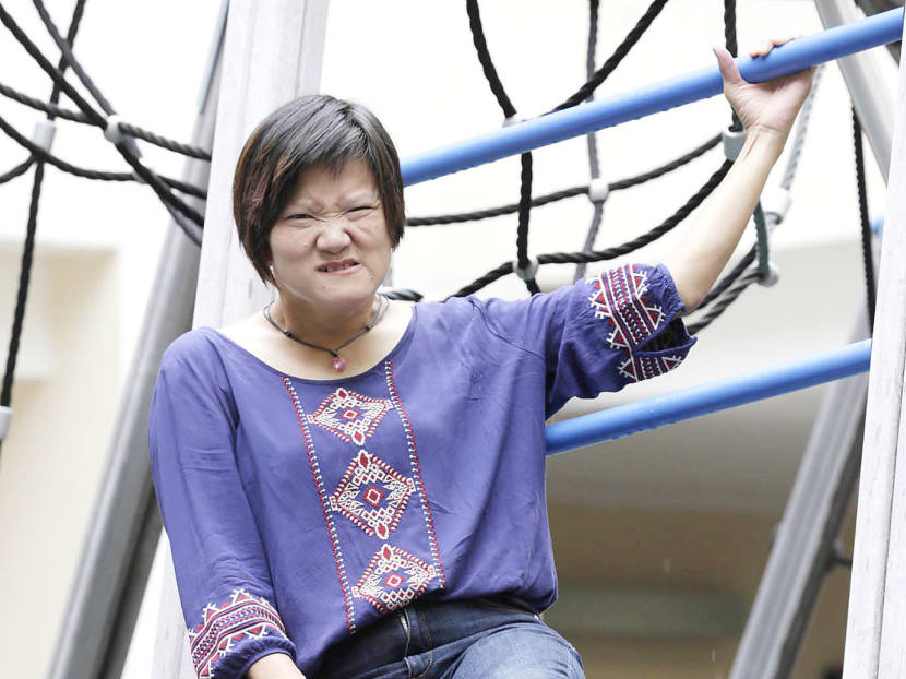 Ms Oh Siew May was born with cerebral palsy, but that did not stop her from writing a book, Scaling Walls, which was published in 2009. Photo: Wee Teck Hian Ms Oh Siew May was born with cerebral palsy, but that did not stop her from writing a book, Scaling Walls, which was published in 2009. Photo: Wee Teck Hian
