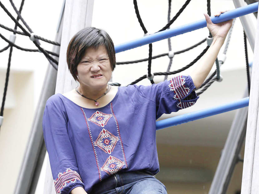 Ms Oh Siew May was born with cerebral palsy, but that did not stop her from writing a book, Scaling Walls, which was published in 2009. Photo: Wee Teck Hian