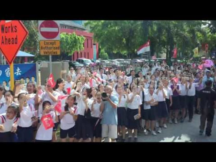 Schooling bus parade passes by Dunman High School