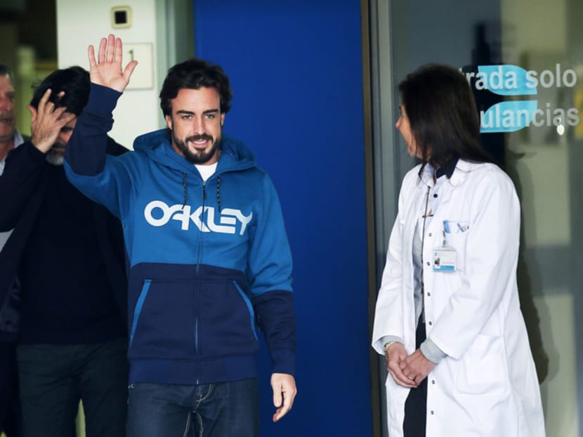 Alonso leaving the hospital in Sant Cugat, Spain, on Feb 25 after three nights there following his accident. Photo: Reuters