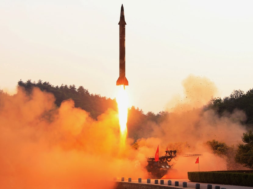 File photo shows a ballistic rocket being test-fired through a precision control guidance system in this undated photo released by North Korea's Korean Central News Agency (KCNA) on May 30, 2017. Photo: Reuters