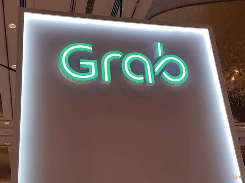FILE PHOTO: A Grab logo is pictured at the Money 20/20 Asia Fintech Trade Show in Singapore March 21, 2019. REUTERS/Anshuman Daga