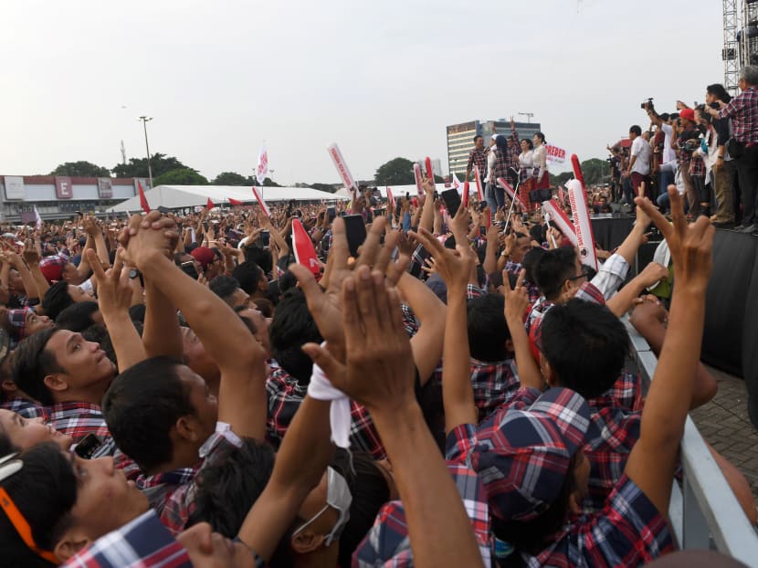 Supporters cheering as Jakarta's governor Basuki Tjahaja Purnama makes his way on stage during his final campaign rally in Jakarta on Feb 11, 2017. Photo: AFP Supporters cheering as Jakarta's governor Basuki Tjahaja Purnama makes his way on stage during his final campaign rally in Jakarta on Feb 11, 2017. Photo: AFP