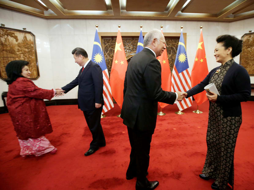 Malaysia’s Prime Minister Najib Razak (centre) and his wife Rosmah Mansor (in red) meeting China’s President Xi Jinping and his wife Peng Liyuan at Diaoyutai State Guesthouse in Beijing on Nov 3, 2016. Among the deals inked was Putrajaya’s first significant defence deal with Beijing. Photo: Reuters