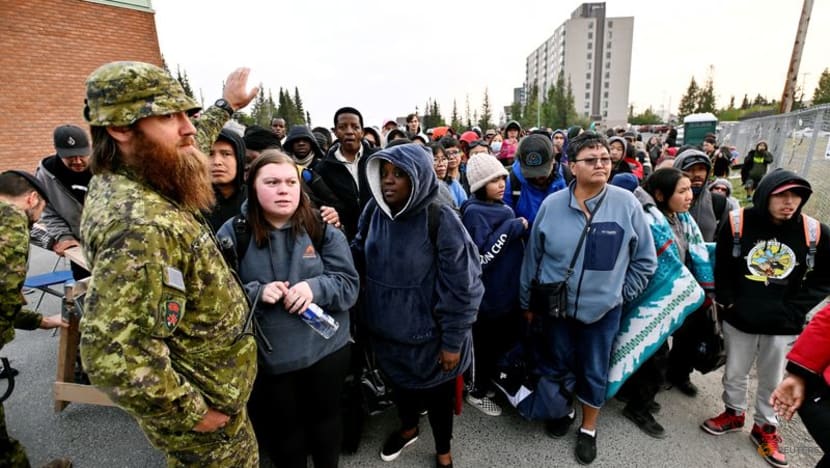 Canadian firefighters race flames to evacuate Yellowknife