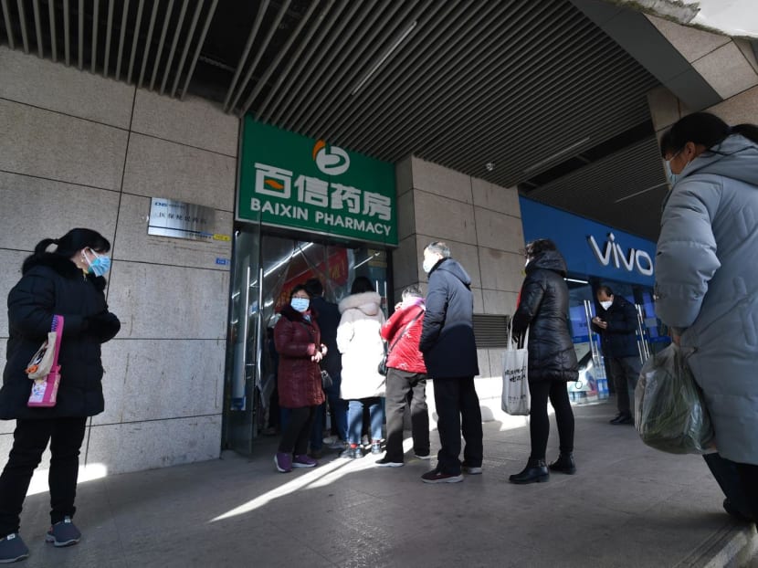 People queue to buy antigen test kits at a pharmacy amid the Covid-19 pandemic in Nanjing, in China's eastern Jiangsu province, on Dec 15, 2022 shows People queue to buy antigen test kits at a pharmacy amid the Covid-19 pandemic in Nanjing, in China's eastern Jiangsu province, on Dec 15, 2022 shows