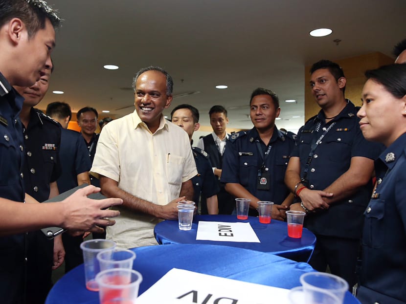 Mr Shanmugam meeting police officers during his visit to the Central Division, Police Cantonment Complex, on Nov 30, 2015. TODAY file photo