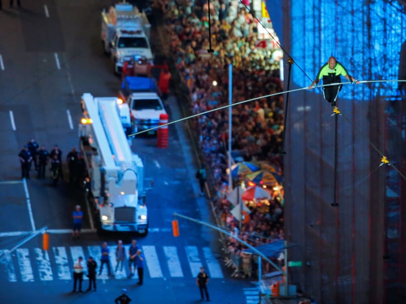 Photo of the day: Aerialist Nik Wallenda walks on a highwire 25 storeys above New York's busy Times Square, in a live television event on Sunday, June 23.