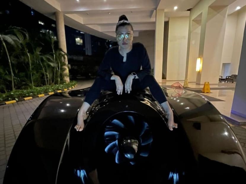 Shaira Khan posing with her Batmobile.
