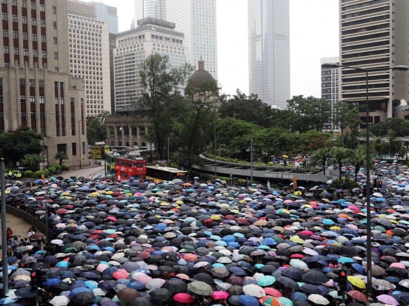 Umbrellas go up in Central, Hong Kong, as thousands of teachers brave heavy rain to show solidarity with their students. Umbrellas go up in Central, Hong Kong, as thousands of teachers brave heavy rain to show solidarity with their students.