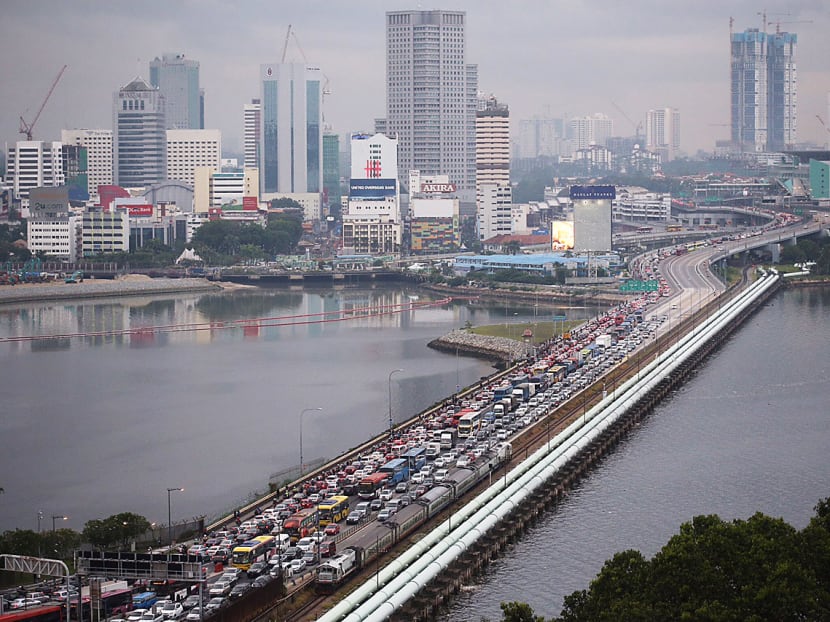 Johor Chief Minister Osman Sapian said the crooked bridge would help ease congestion into Singapore and reduce pollution in the Tebrau Straits.