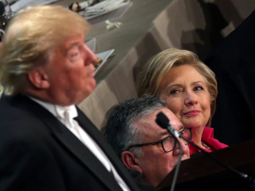 Democratic U.S. presidential nominee Hillary Clinton looks at Republican U.S. presidential nominee Donald Trump during the Alfred E. Smith Memorial Foundation dinner to benefit Catholic charities in New York, U.S. October 20, 2016. Photo: Reuters