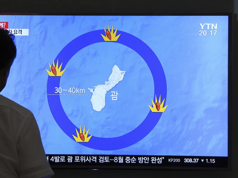 In this Thursday, Aug. 10, 2017, file photo, a man watches a TV screen showing a local news program reporting on North Korea's threats to strike Guam with ballistic missiles, at the Seoul Train Station in Seoul, South Korea. Photo: AP