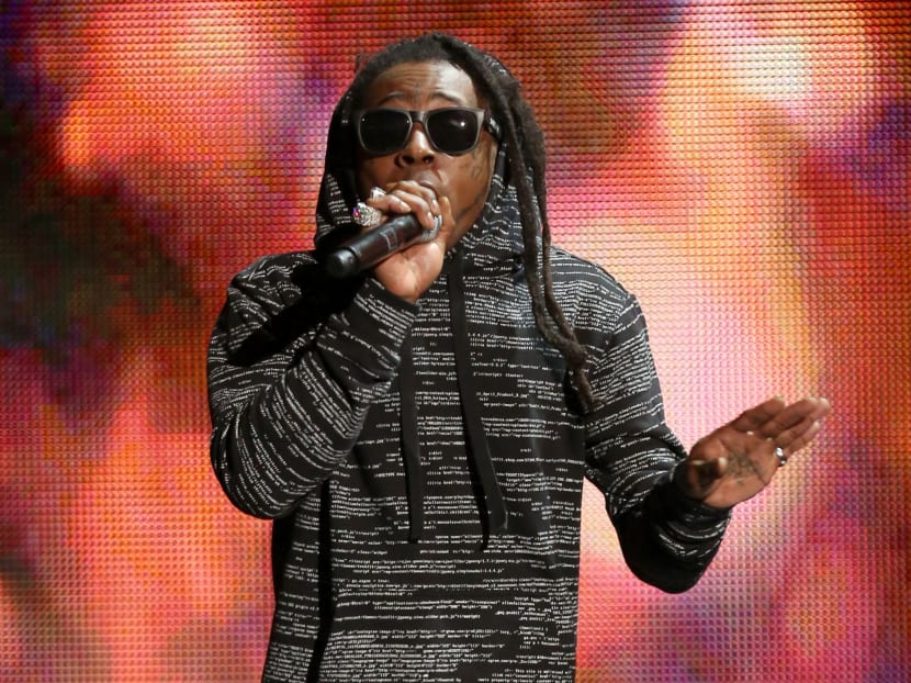 In this Nov 23, 2014 file photo, Lil Wayne performs on stage at the 42nd annual American Music Awards in Los Angeles. Photo: AP