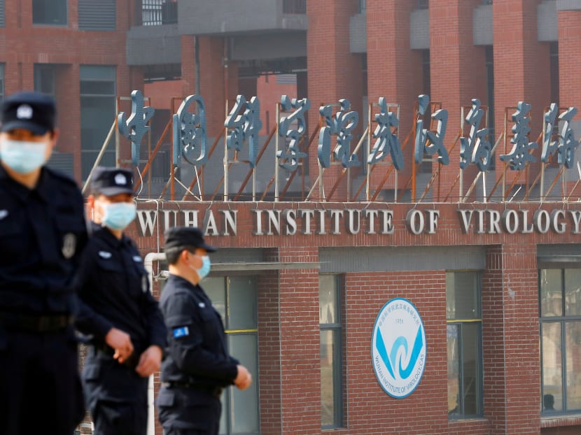 Security personnel keep watch outside the Wuhan Institute of Virology during the visit by the World Health Organization (WHO) team tasked with investigating the origins of Covid-19 in Wuhan, Hubei province, China on Feb 3, 2021.
