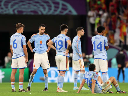 Spain's midfielder and captain Sergio Busquets (second from left) and his team players reacting after they lost the penalty shootout against Morocco at the Qatar 2022 World Cup last-16 match on Dec 6, 2022
