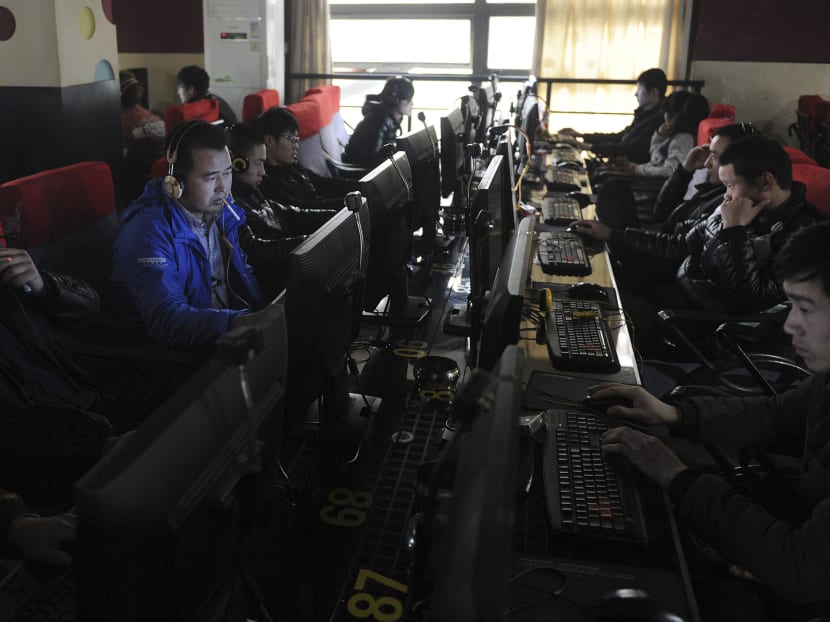 Customers use computers at an internet cafe in Hefei, Anhui province March 16, 2012. Beijing-based microbloggers are required to register on the Weibo platform using their real identities or face unspecified legal consequences, in a bid to curb what Communist officials call rumours, vulgarities and pornography. Photo: Reuters