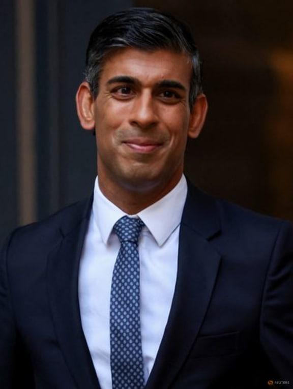 New leader of Britain's Conservative Party Rishi Sunak stands outside the party's headquarters in London, Britain, October 24, 2022. REUTERS/Henry Nicholls 