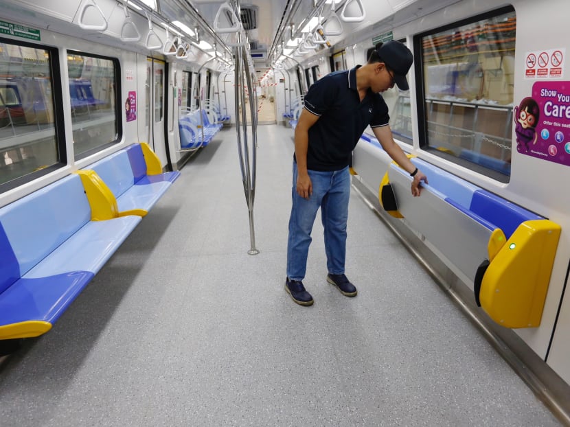 The trains feature new livery and tip-up seats, which can be folded up or down to allow for more standing space on trains. Photo: Raj Nadarajan/TODAY