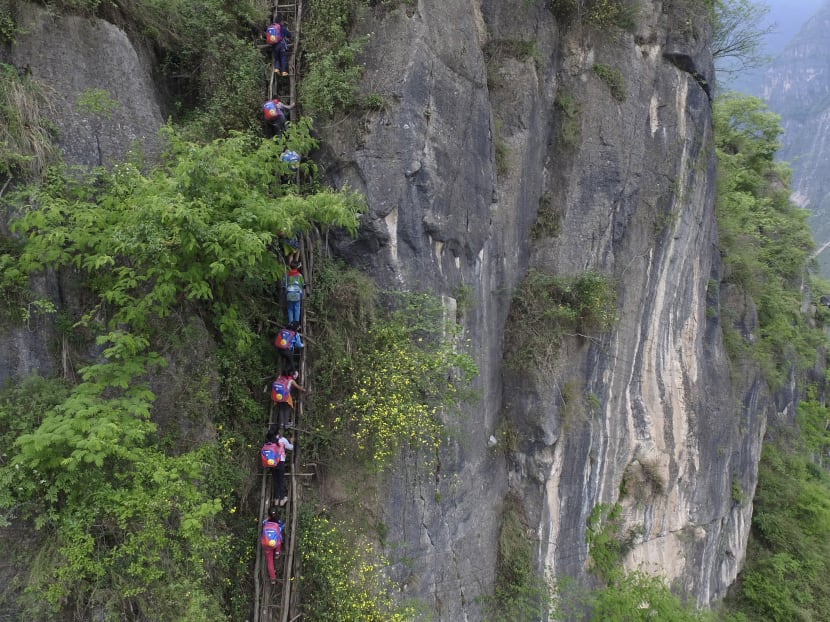 Village where children climb cliffside ladder may get stairs