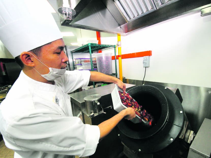 Restaurant group Tung Lok has introduced Artificial Intelligence Cooking Machines into its central kitchen. Photo: Ernest Chua