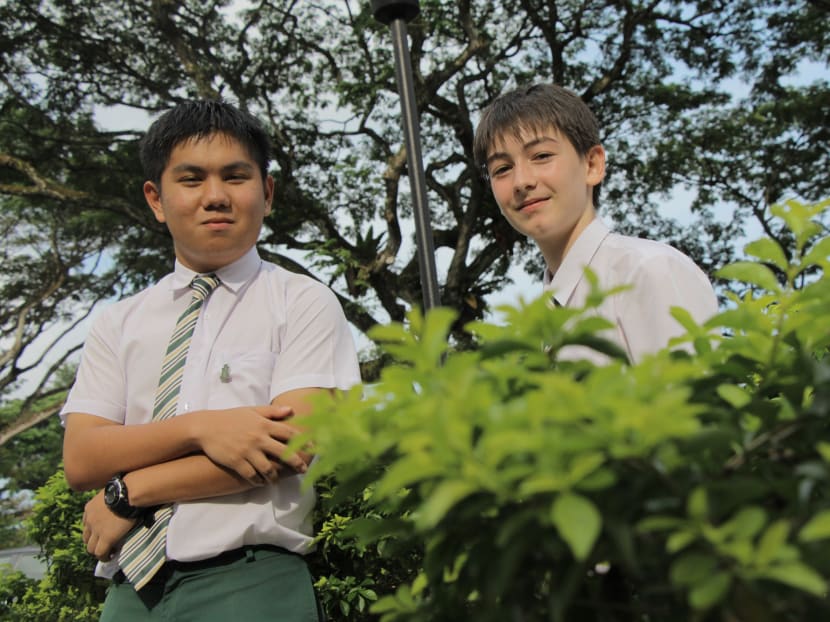 Benjamin Chan (left) and Paul Jeanbert of SJI Internationl work on harnessing solar energy through plants. Photo: Sion Touhig